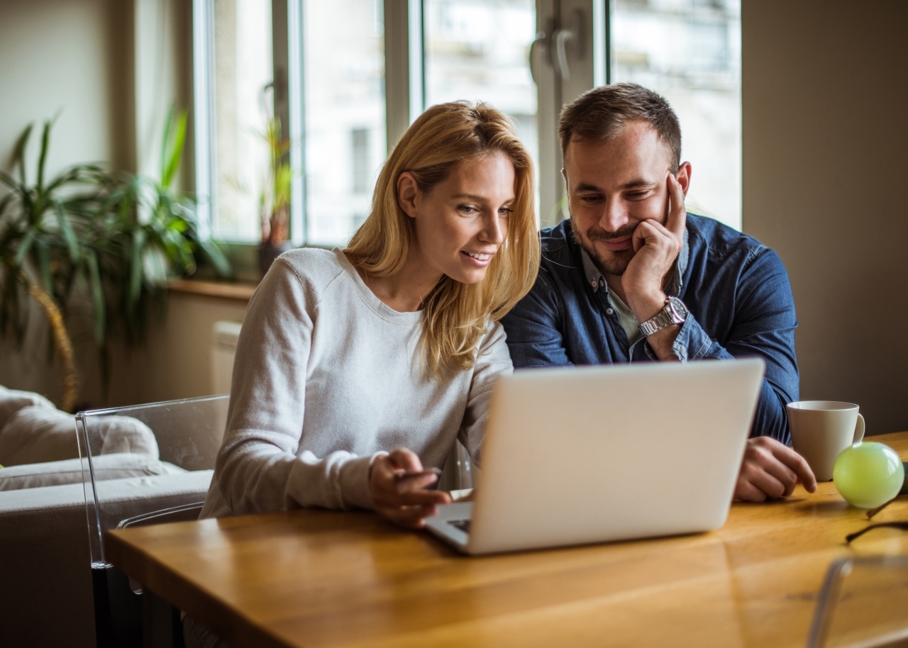 Couple looking at laptop